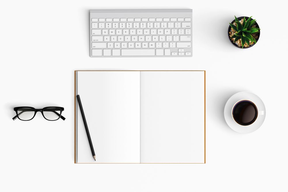 Modern workspace with coffee cup, smartphone, paper, tablet and notebook copy space