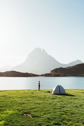 Man near the tent in the mountain