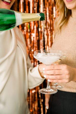 Crop women with champagne