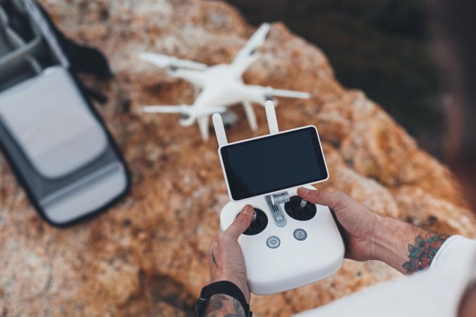 Man with drone and remote