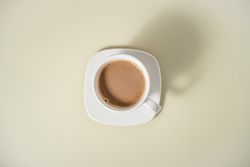 Flat lay of a ceramic cup of coffee