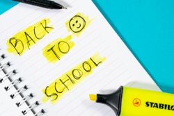Notebook with writing Back to School with green stabilo