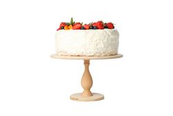 Berry cream cake on wooden stand isolated on blank background