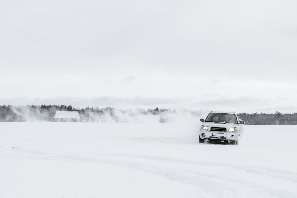 Car driving on snow field