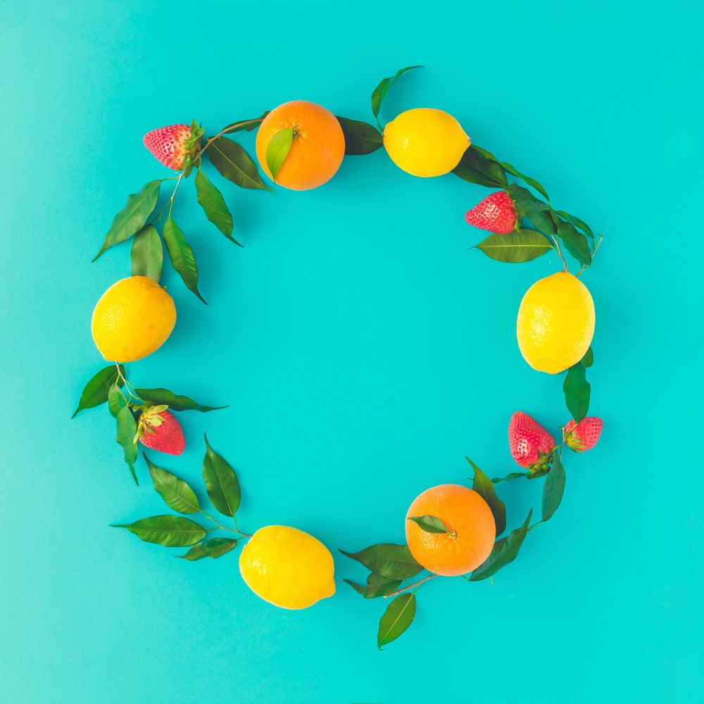 Citrus wreath on bright blue background