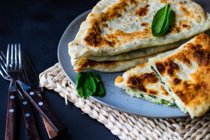 Close up of Azerbaijan flat bread, kutaby, with herbs