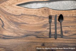 Dark cutlery on stylish wooden table bGg1Vb