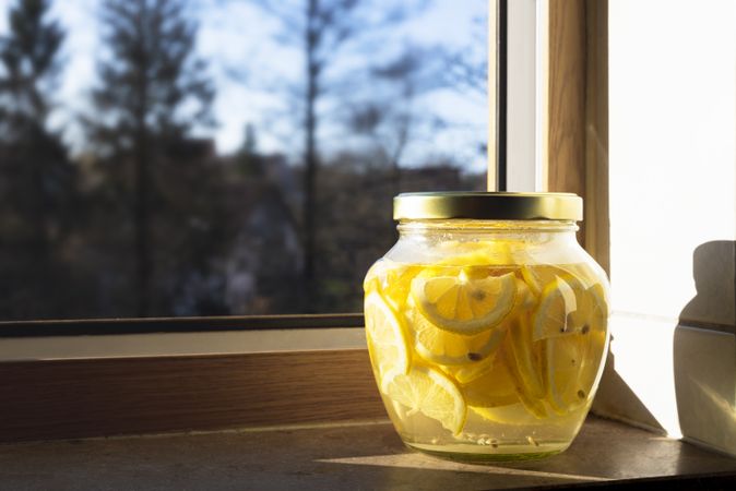 Jar of lemon slices in lemonade