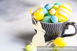 Cup of decorative eggs with rabbit ornaments 0LdNpE