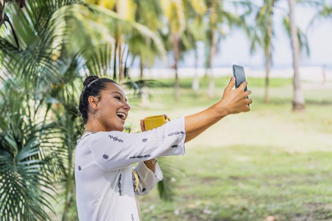 Cheerful woman taking a selfie with mobile phone