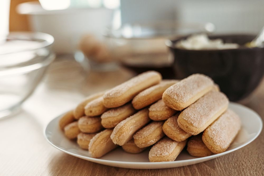 Plate of lady fingers, ingredients for cooking tiramisu