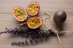 Juicy sliced passion fruit and bunch of lavender