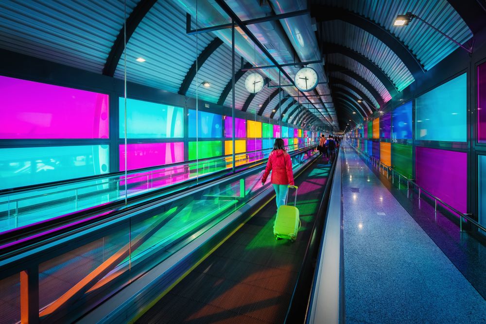 Woman standing on travelator in airport