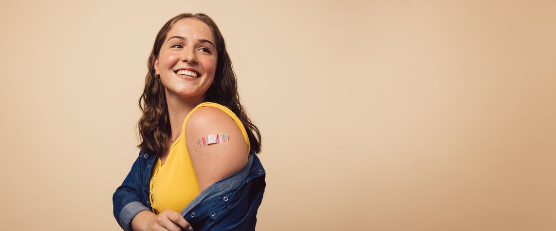 Woman looking happy after getting immunization vaccine