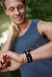 Male jogger checking heart rate