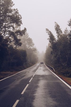 Car on road in overcast day