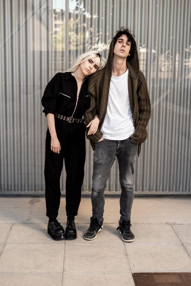 Couple near stripped modern building