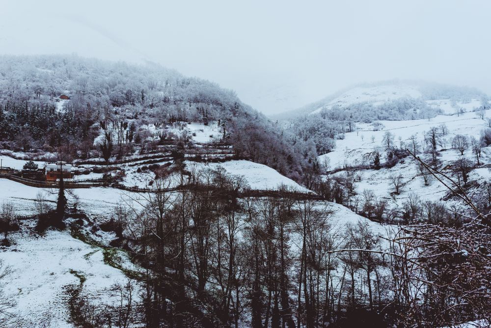 Amazing winter valley near hills