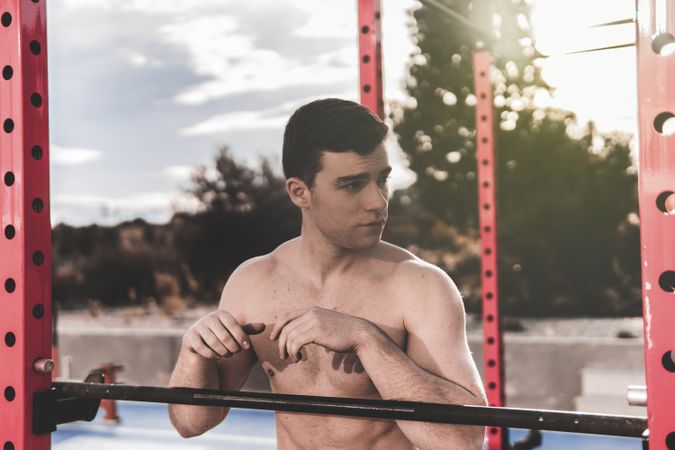 Shirtless man on sports ground