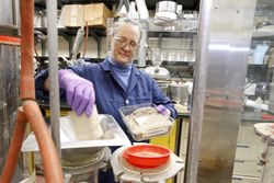 Fort Detrick, MD - USA, Feb 2011: Female scientist studying natural products 5rZ8l5