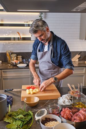 Mature man cooking in kitchen