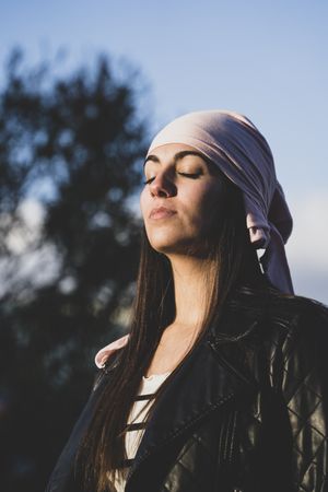 Young woman with cancer bandana