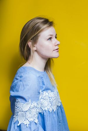 Blonde woman posing in studio