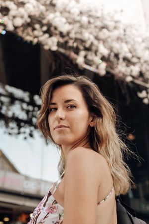 Woman against sunny blurred background