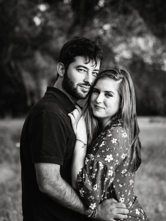 Young happy couple embracing in beautiful garden