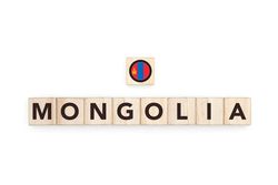 Wooden blocks bearing the name and flag of Mongolia. Mongolian and Asian Culture, national identity, travel, and geography in a copy space design.