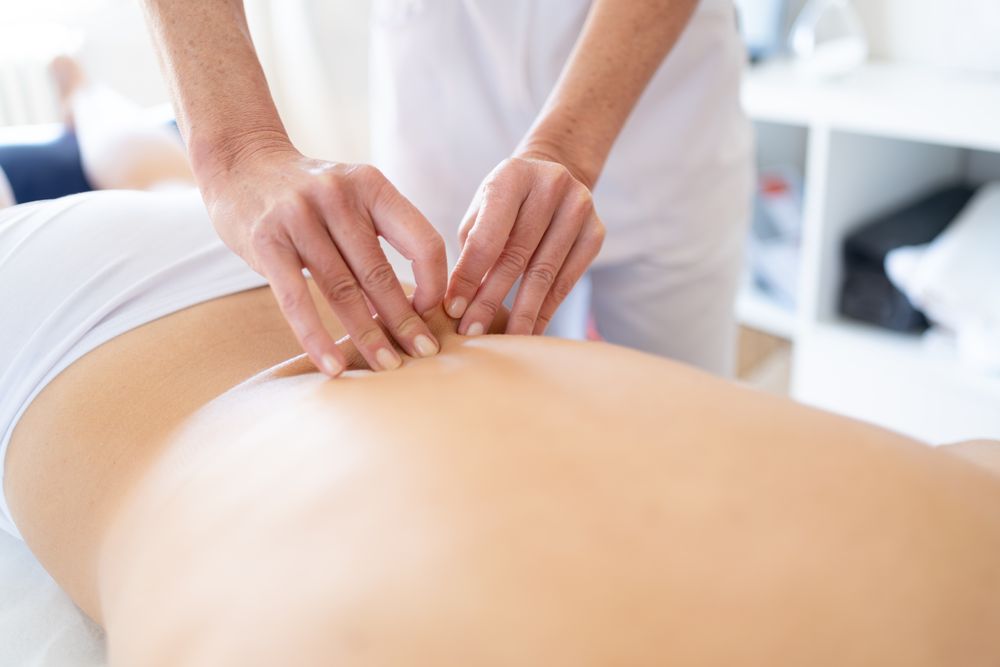 Close up of lower back of client having a massage