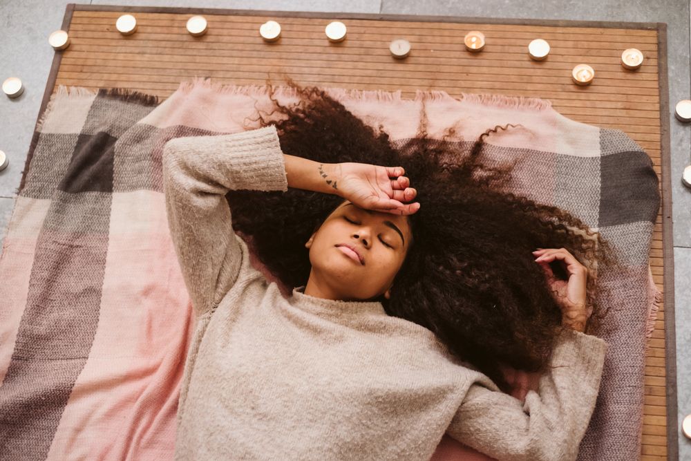 Black woman lying on floor