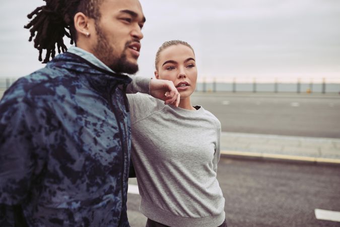 Beautiful woman leaning on her boyfriend and looking away