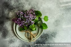 Top view of spring table setting with lilac 4MGAMy