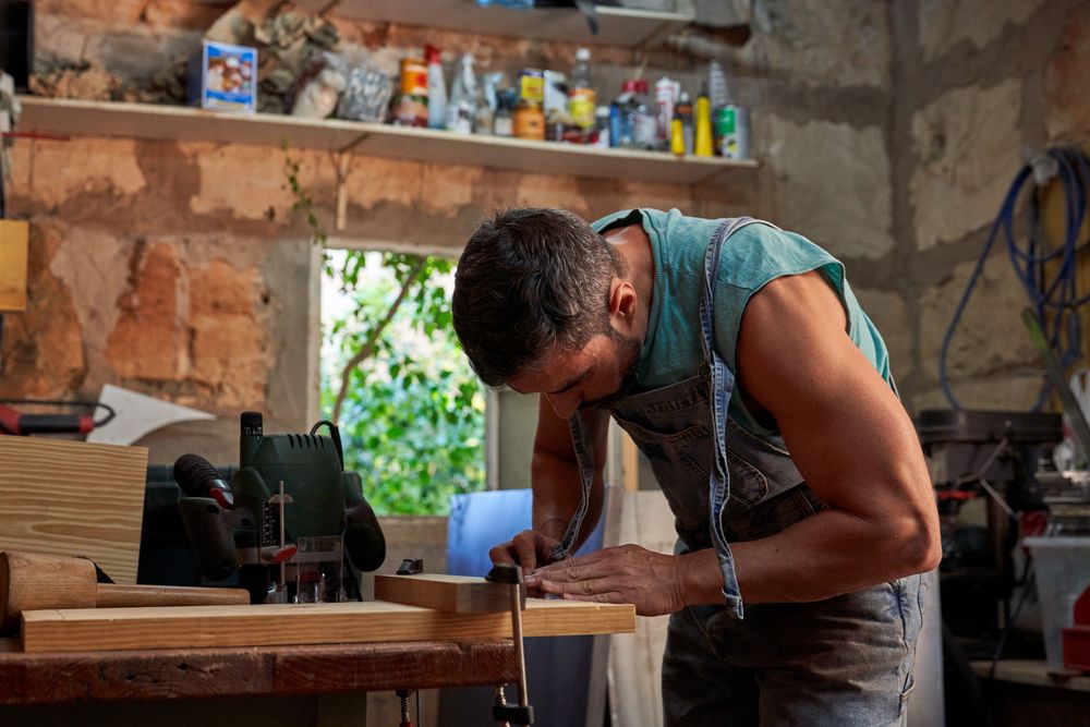 Focused male carpenter in workshop
