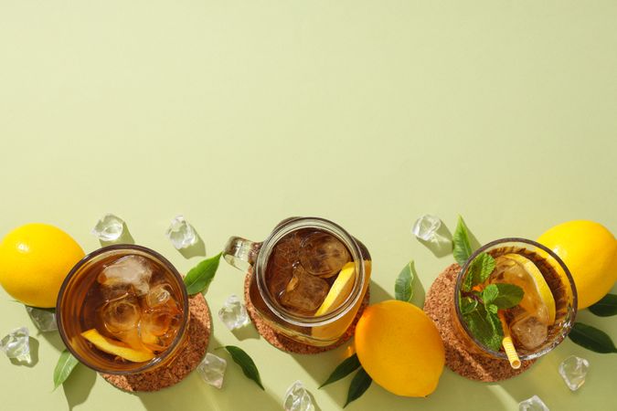 Cold tea with ice, mint leaves and orange slices