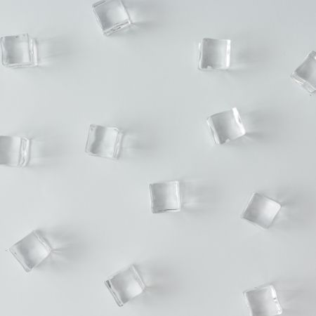 Ice cubes pattern on bright background