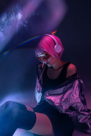 Woman sitting and listening to music