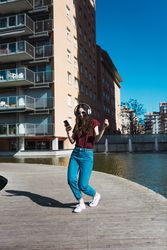 Woman listening to music with headphones.