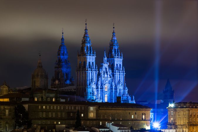Majestic Gothic cathedral with blue illumination in night time