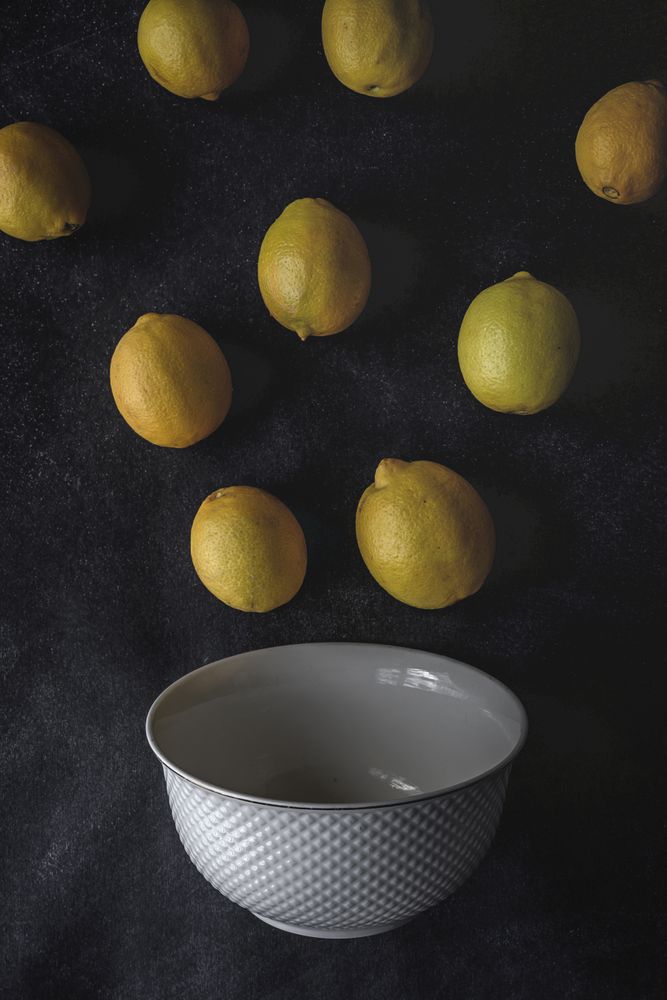 Fresh lemons on dark background.