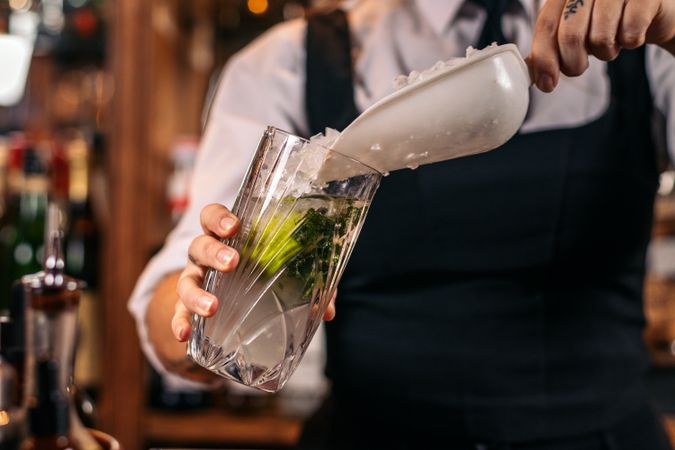 Unrecognizable bartender preparing a mojito
