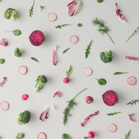 Colorful vegetable pattern made of broccoli, beetroot and radish