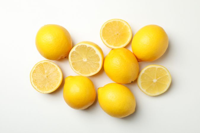 Fresh lemons on light background, top view. Ripe fruit