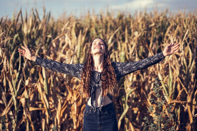 Energizing Freedom in Nature A Woman Fully Embracing the Beautiful Outdoors Around Her