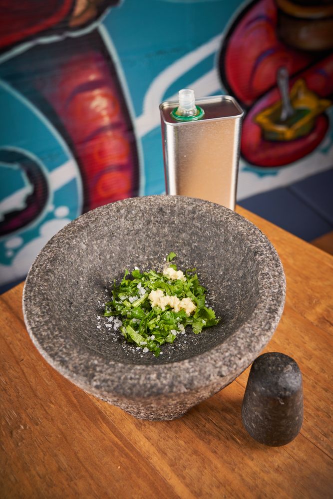 Greens in mortar on table