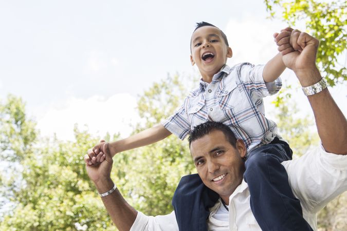 Hispanic Father and Son Having Fun in the Park