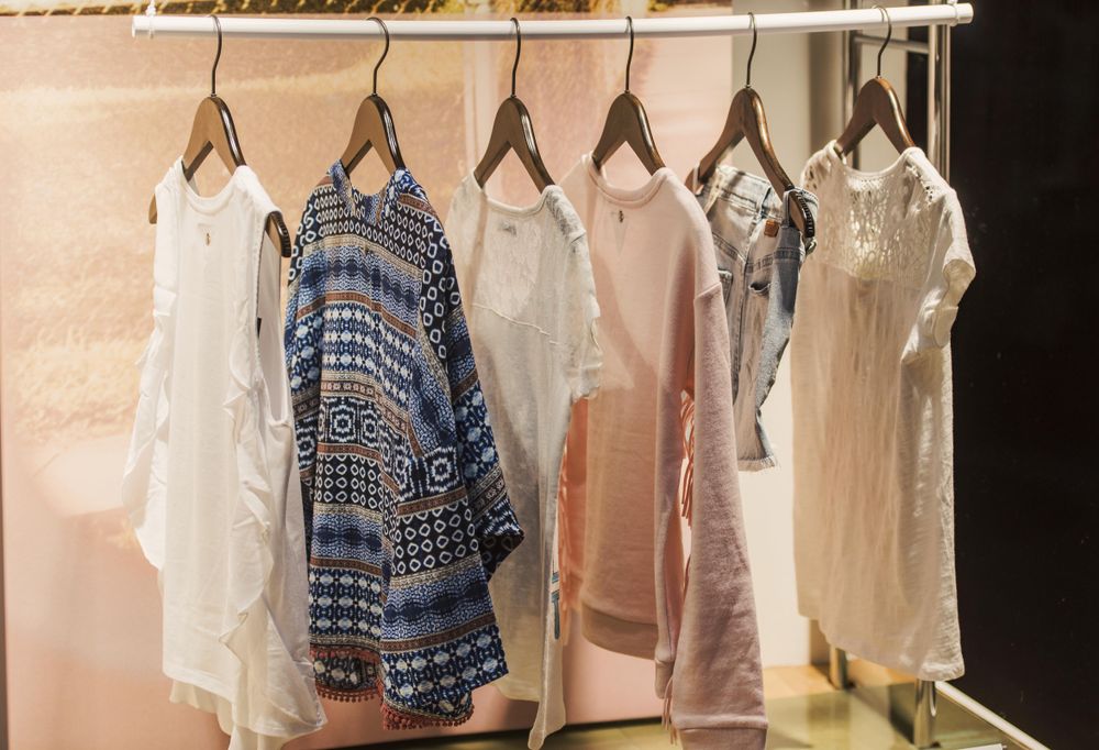 Clothes rack of summer wardrobe in fashion store