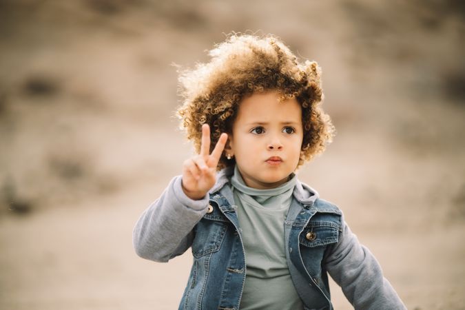 curly toddler on nature