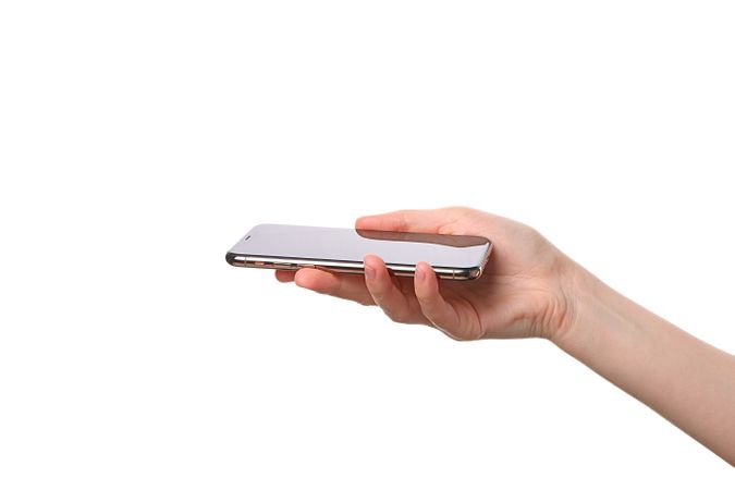 A person is holding a smartphone with a clean, modern look